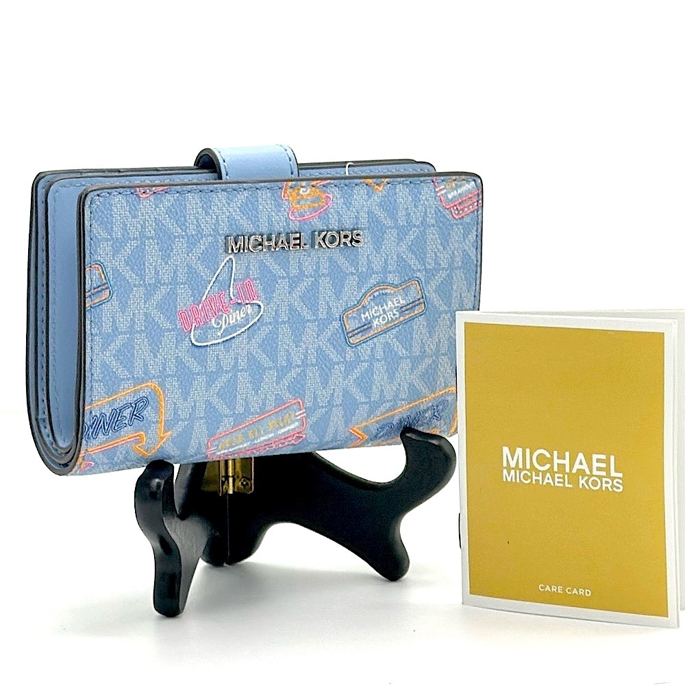 Michael Kors Jet Set Travel Medium Printed Signature Logo Bi-Fold Wallet
LT SKY